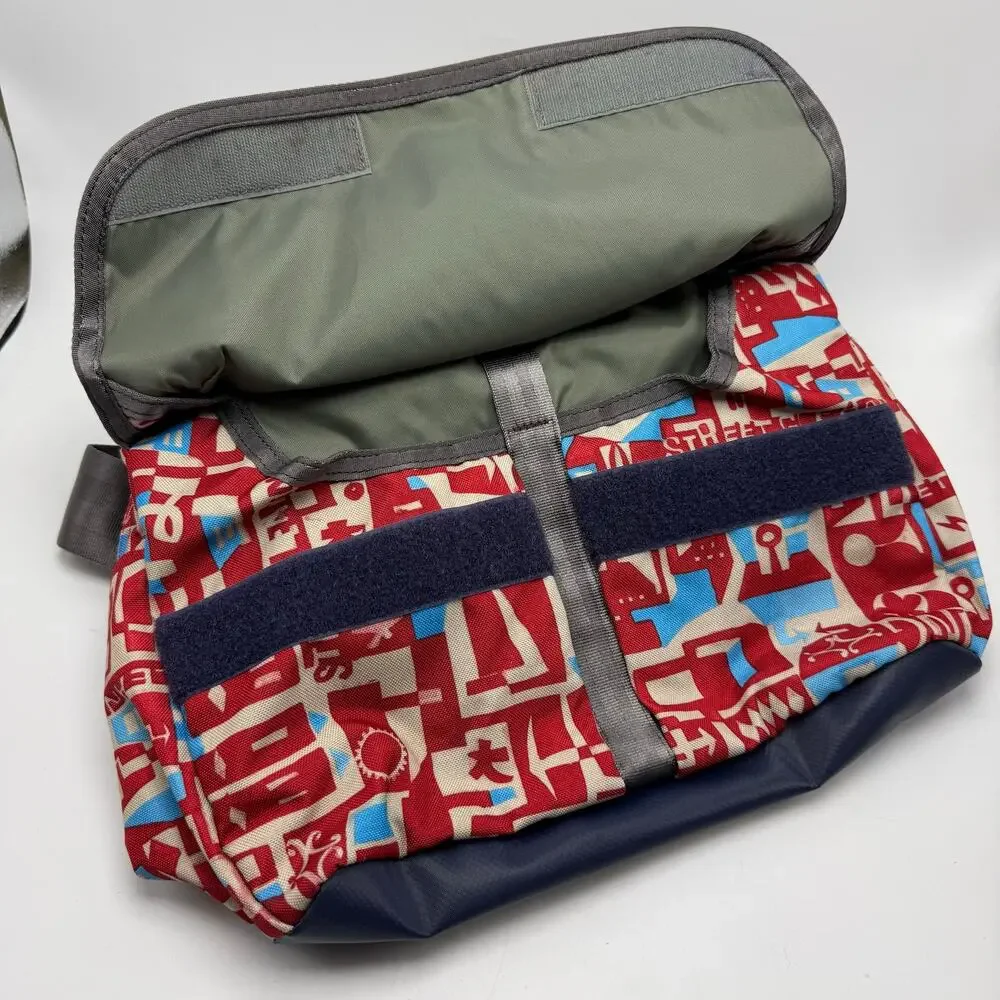 Gregory Water Resistant Flap Front Messenger Shoulder Bag Red Blue Cityscape